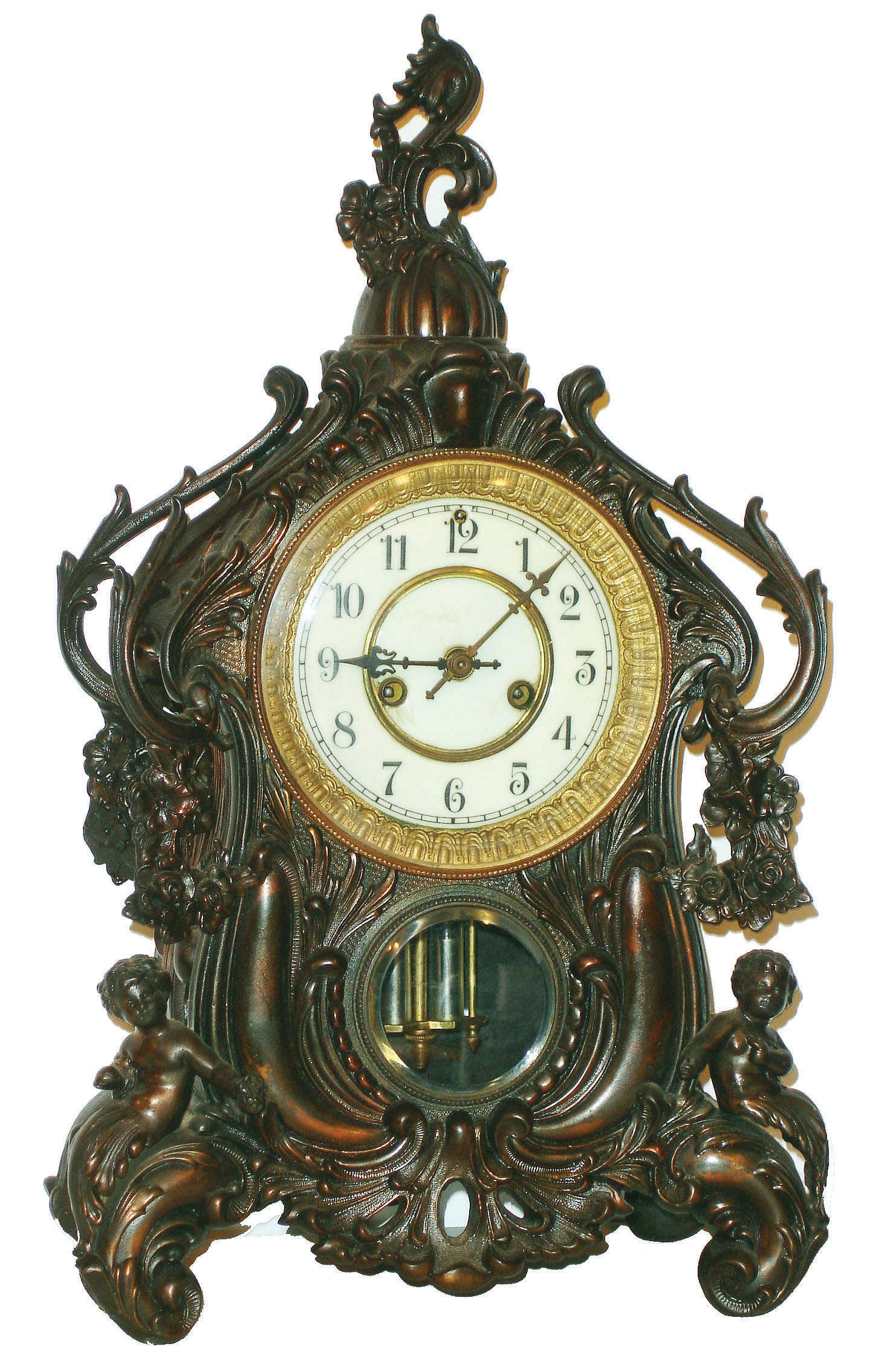 Waterbury Clock Co., Waterbury, Conn., "Valiant" shelf clock, 8 days, time and strike, spring driven movement in a cast metal case with Japanese Bronze finish and enamel dial, c1906 — Antique Clocks Price Guide