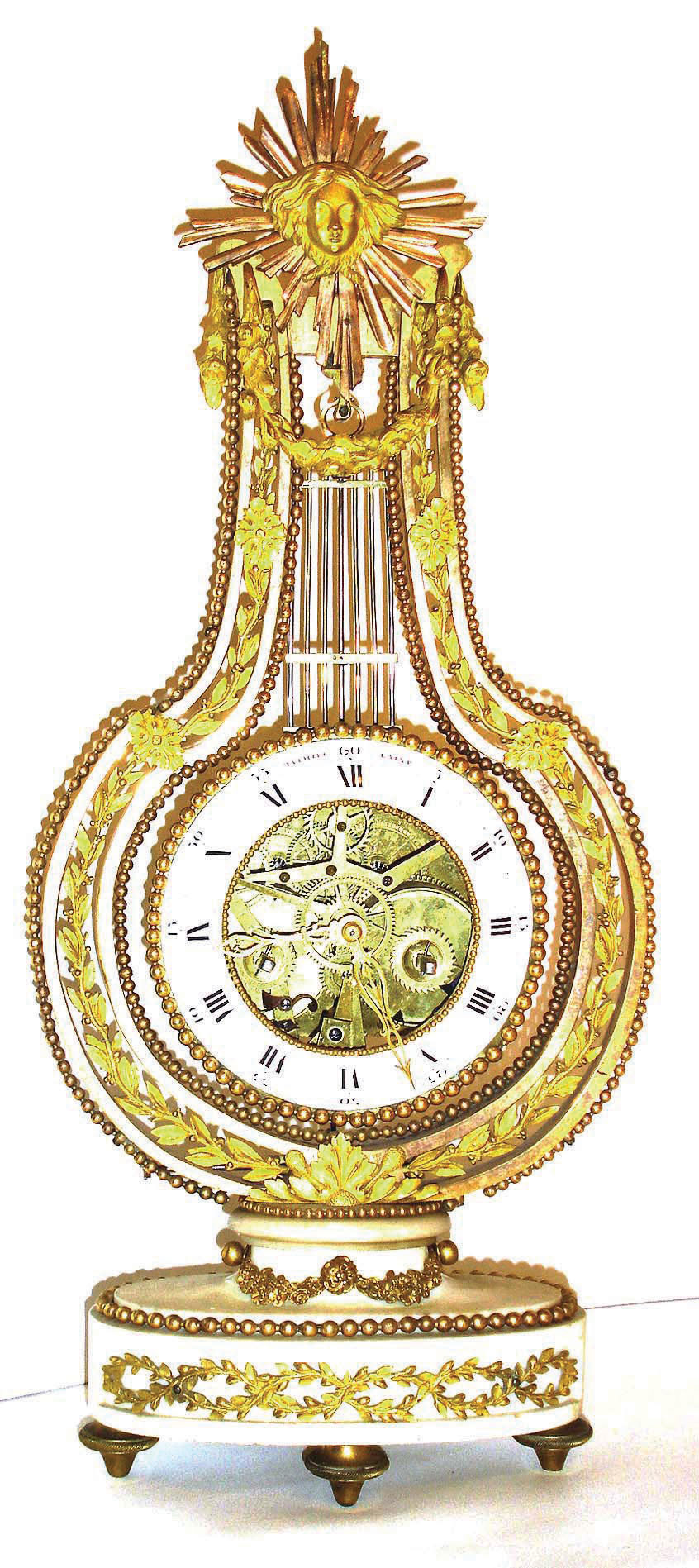 French, Mathieu Laine, La Pendule Louis XVI, an ormolu lyre on a white marble base, the skeletonized movement forming the actual pendulum, suspended from a knife edge, with tic-tac escapement and count wheel striking on a bell, c1790. — Antique Clocks Price Guide