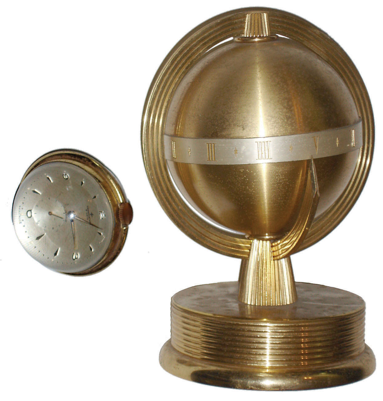 Clocks- 2 (Two) Swiss 8 day desk timepieces: Accura brass globe form annular dial; Observator brass and glass paperweight ball form 17 jewel; mid 20th century — Antique Clocks Price Guide