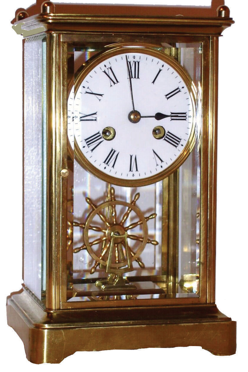 France, very unusual crystal regulator with ships wheel pendulum, polished brass case brass bezel with Roman numeral white enamel dial, blued steel hands, 8 day pendule a Paris movement with Brocot escapement, striking on a bell, with ships wheel form pendulum, the pendulum suspended on pivots in a saddle mounted to the case bottom, and driven by a long crutch, c1900 — Antique Clocks Price Guide