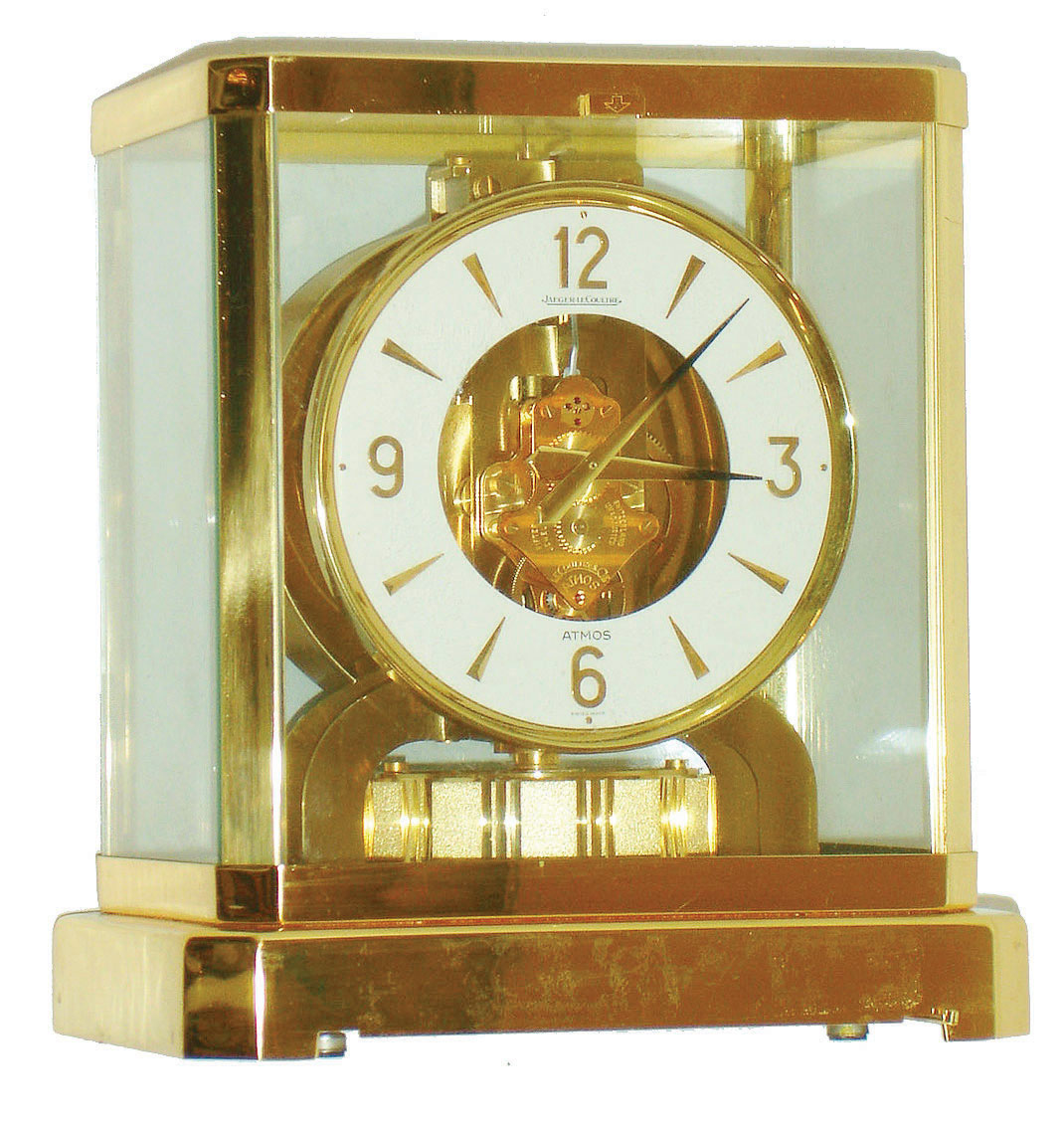 Jaeger - LeCoultre, Switzerland, Atmos clock, 15 jewel gilt caliber 528-1 movement, gilt torsion pendulum, round white painted dial with applied gilt Arabic numerals and arrow markers, gilt hands with back tips, contained in a glazed rectangular case with removable front panel, 9 1/4" h, serial #396761 — Antique Clocks Price Guide