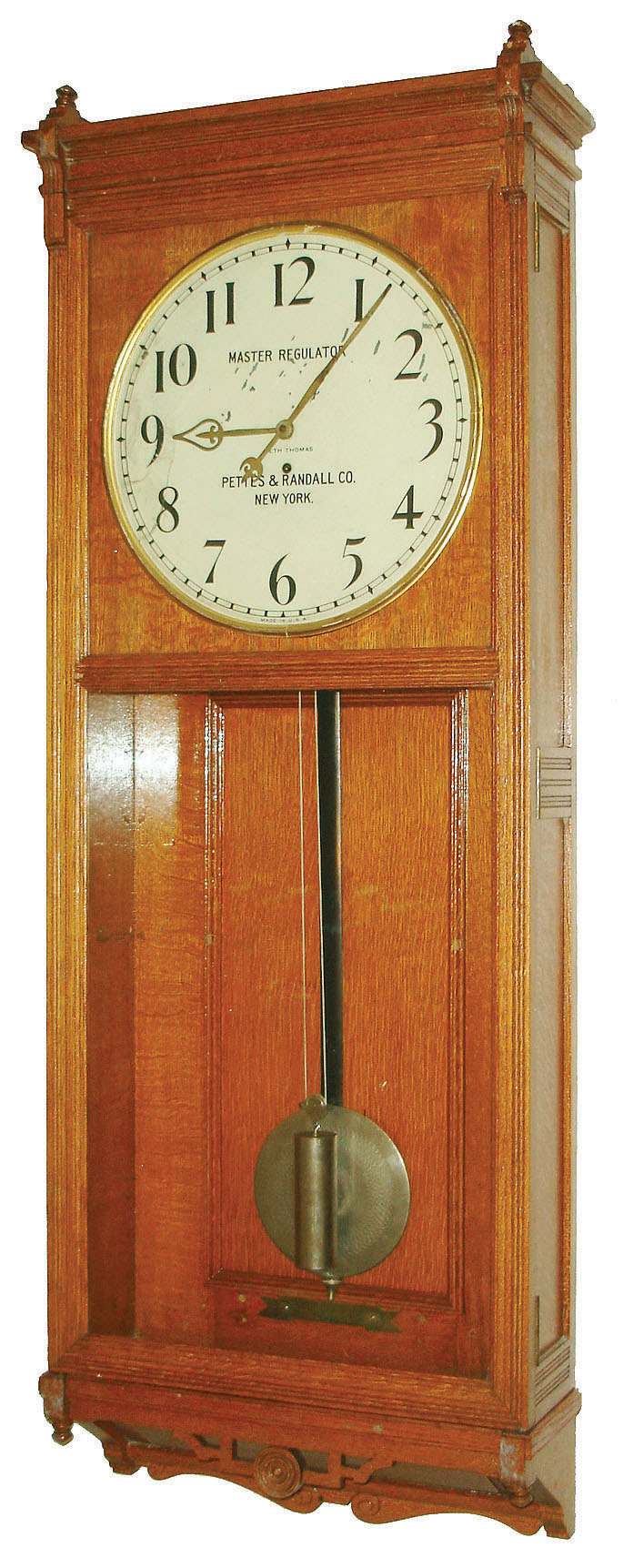 Seth Thomas Clock Co., Thomaston, Conn., "Master Clock M" wall clock, 8 days, time only, weight driven movement in an oak case with 18" painted metal dial signed "MASTER REGULATOR, PETTES &amp; RANDALL CO. NEW YORK", c1922 — Antique Clocks Price Guide