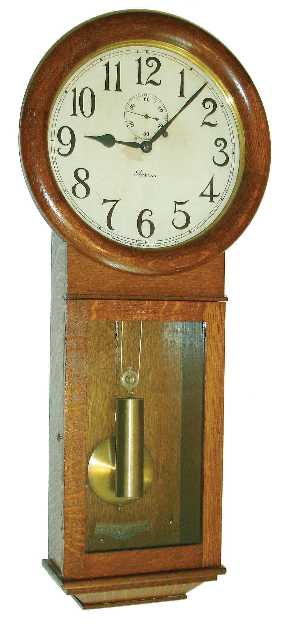 Ansonia Clock Co., New York, NY, "Standard Regulator" wall clock, 8 days, time only, weight driven movement in an oak case with papered metal dial with seconds bit, c1920 — Antique Clocks Price Guide