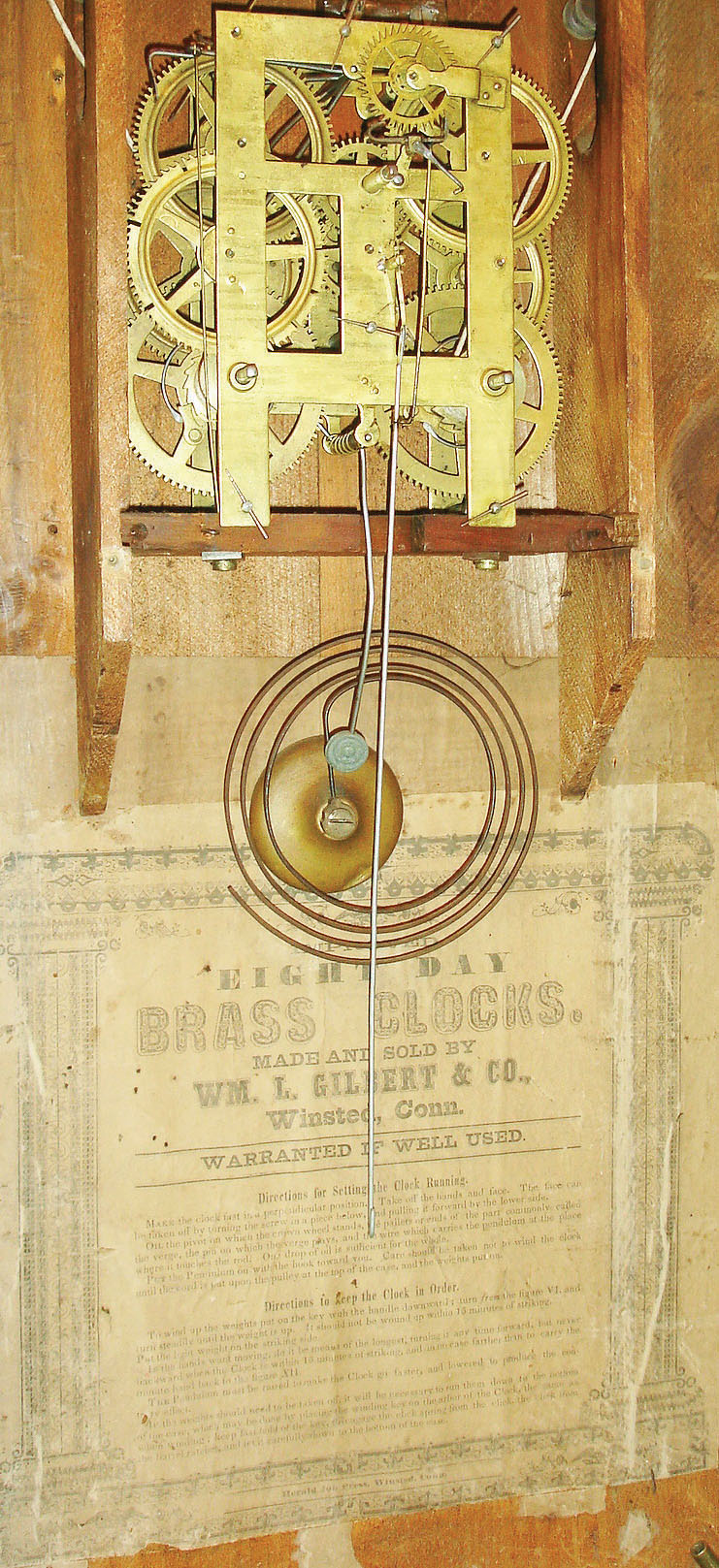 Wm. L. Gilbert &amp; Co., Winsted, Conn., 8 day, time and strike weight brass movement shelf clock, c1858.  This case was designed by Chauncey Jerome as noted in the label pasted inside the door that reads: "Patented April 14, 1857, by Chauncey Jerome", — Antique Clocks Price Guide