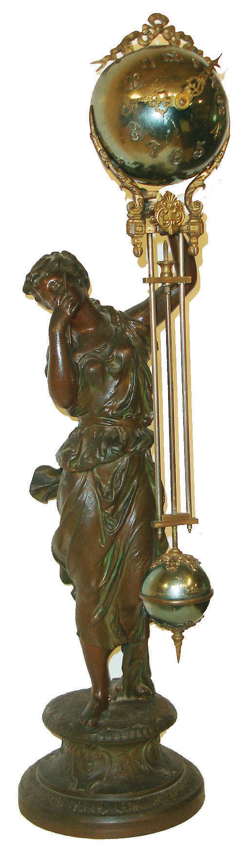Ansonia Clock Co., New York, New York, "Juno" ball swinger figural mantel clock, 8 days, time only, spring driven movement in a bronze finished ball case supported by a statue of the Roman goddess Juno, c1906 — Antique Clocks Price Guide