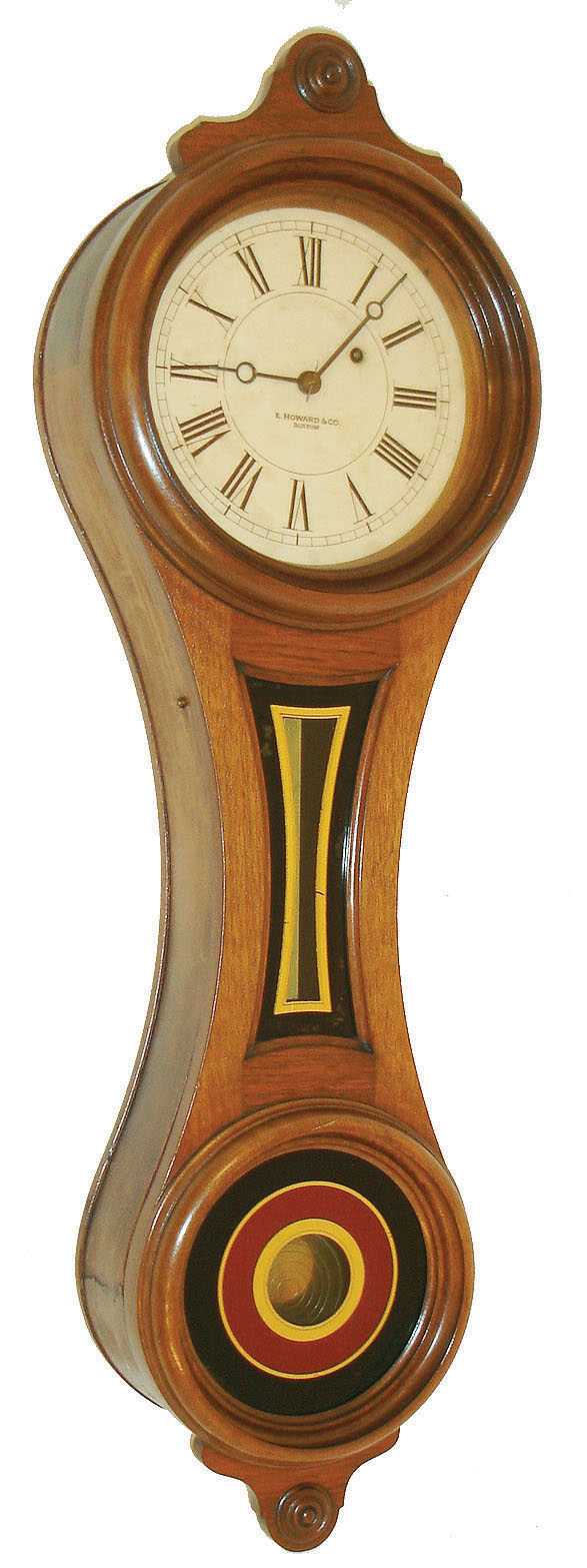 E. Howard &amp; Co., Boston, Mass., "No. 10 Regulator" figure eight wall clock, 8 days, time only, weight driven movement in a walnut case with painted iron dial and reverse painted tablets, c1890 — Antique Clocks Price Guide
