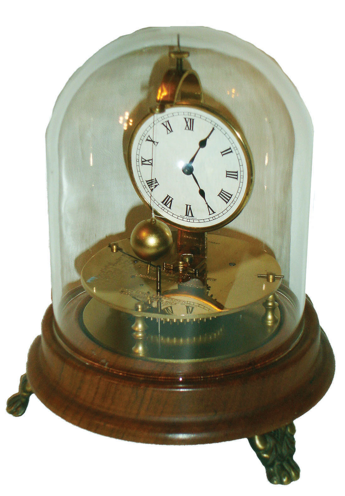 Horolovar Co., Bronxsville, New York, reproduction of the Briggs rotary pendulum timepiece, 8-day, bottom wind with glass dome, c1975 — Antique Clocks Price Guide