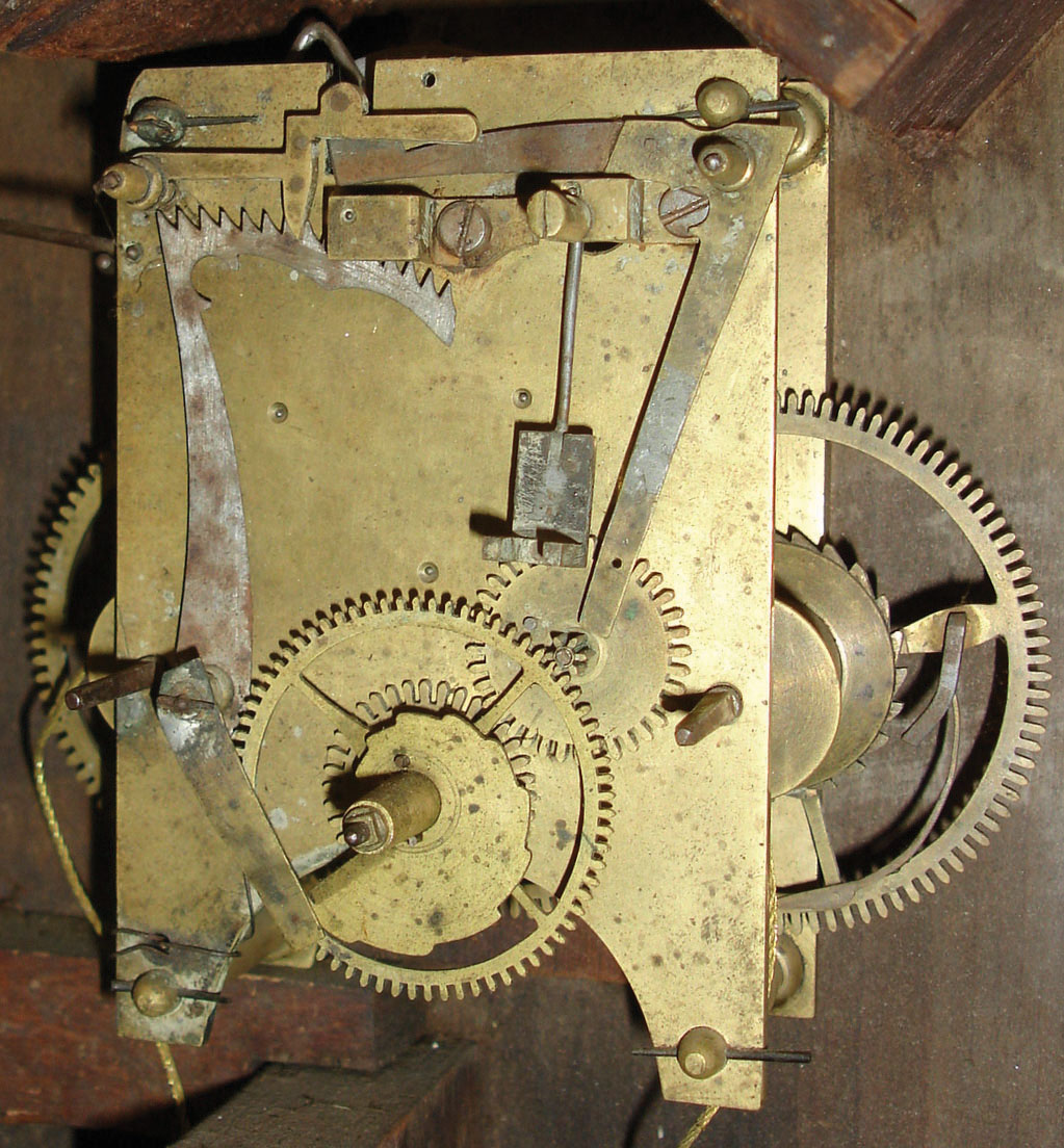 Unknown, 8 day, time and strike weight brass movement New Hampshire mirror clock, c1830.   Based on a similar looking movement found in "New Hampshire Clocks &amp; Clockmakers" by C. Parsons, pg 232 the movement could be by Abiel Chandler, Concord. — Antique Clocks Price Guide