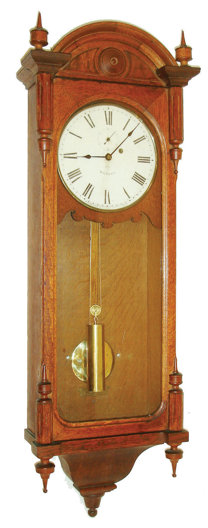Seth Thomas Clock Co., Thomaston, Conn., "Regulator No. 6" wall clock, 8 days, time only, weight driven movement in an oak case with painted metal dial and brass pendulum bob and weight, c1890 — Antique Clocks Price Guide