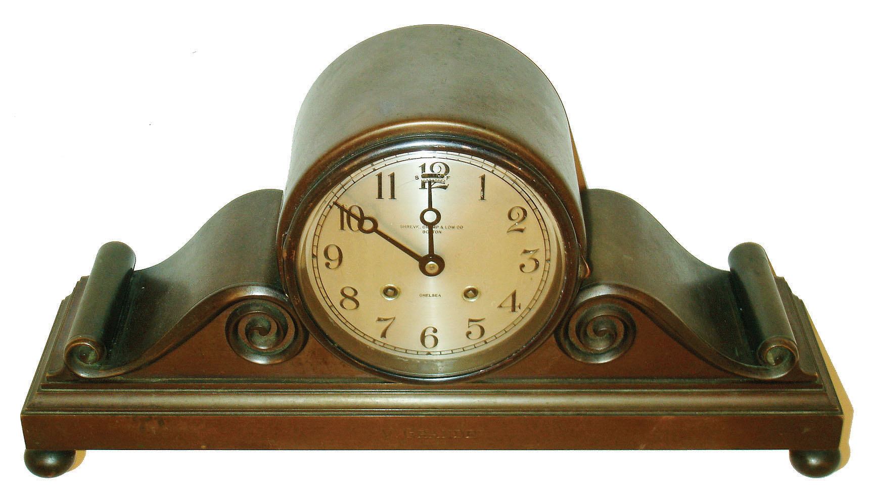 Chelsea Clock CO., Chelsea, Mass., for Shreve, Crump &amp; Low, Boston, "Tambour No. 3", with 5" dial, patinated cast bronze case on ball feet, front of base engraved "V. Grande", bezel with convex, beveled glass, Arabic numeral, silvered dial withy black painted steel moon hands, 8 day time and strike movement sounding the hours and half hour on a gong, serial #180173, c1925 — Antique Clocks Price Guide