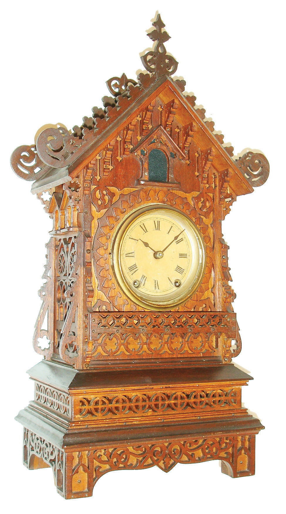 Jig saw or Sorrento work cuckoo clock of architectural form, ash case with walnut fretwork, brass bezel, Roman numeral paper dial, blued steel spade hands, 8 day time and strike Seth Thomas movement, now activating a music box at the hour and half hour, c1885 — Antique Clocks Price Guide