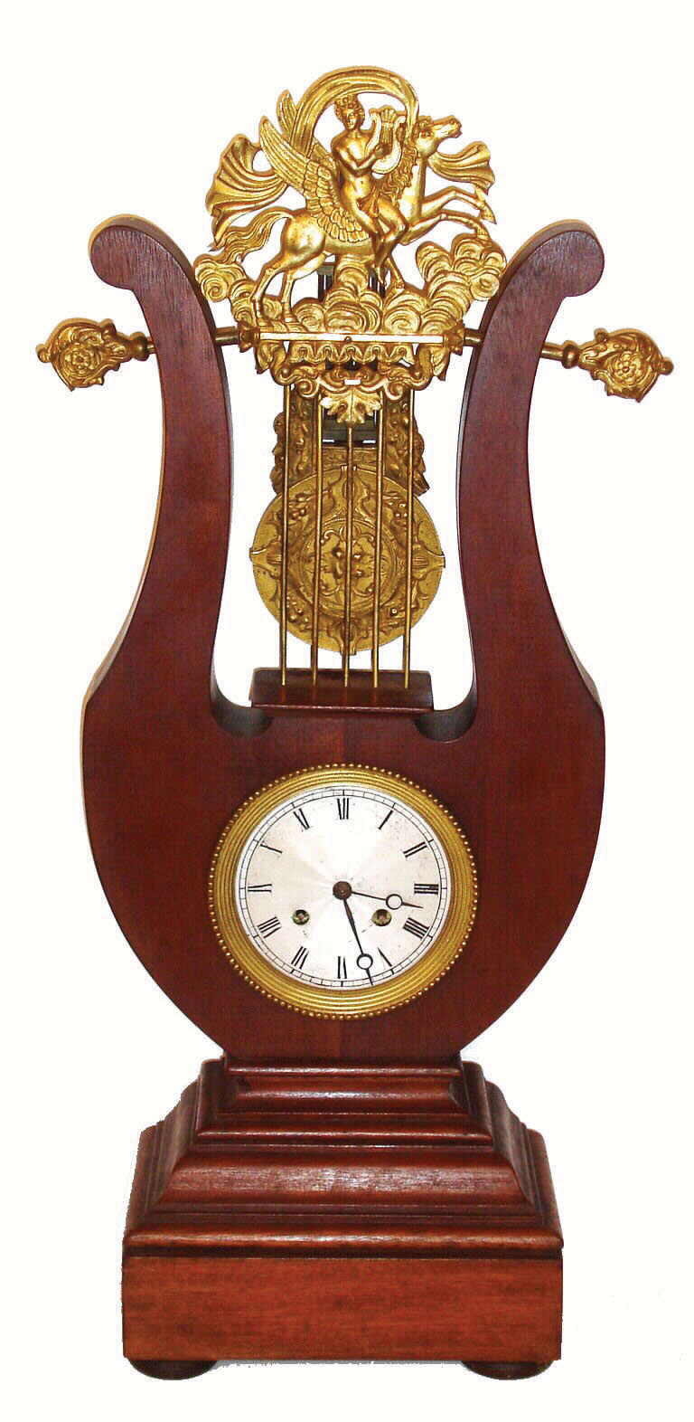 French, lyre form mantel clock, the case of mahogany, and the pendulum suspended above the movement, behind the lyre "strings", c1840 — Antique Clocks Price Guide