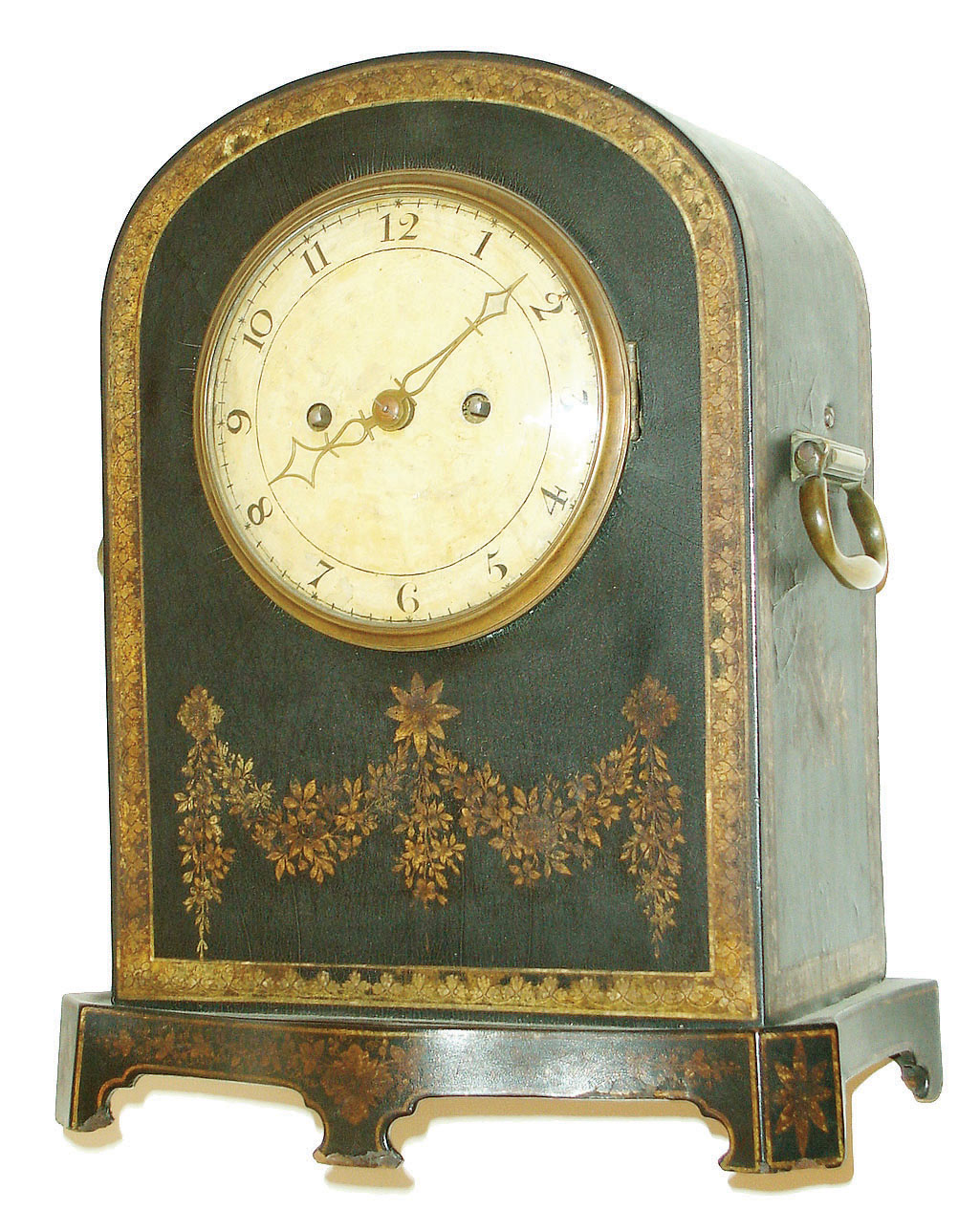 England, paper mache bracket clock, the Japanned case with a repeating, gilt leaf border, the front with floral swags, front of base with trailing vine and edged with a gilt line, case sides with trophies, top with central patera and floral sprays, cast brass carrying handles, brass bezel with convex glass, Arabic numeral, white painted sheet iron dial, brass hands, two train week going fusee movement with decorative engraving on back plate and pendulum, #213, c1820 — Antique Clocks Price Guide