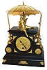European version of the "flying pendulum" clock.  This is an interesting clock, in that an odd movement has been converted to power a center shaft which flails the flying pendulum from post to post, while the time portion of the movement is regulated by a short pivoted pendulum with adjustable bob.