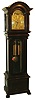 J.J. Elliot, London, England, tall clock, 8 days, time and strike on tube, weight driven movement in a mahogany case with paw feet, fully turned Corinthian columns flanking trunk door, beveled glasses and arch top with silvered chapter ring and moon phase in arch, brass numerals and heavy cutout fancy brass spandrels on corners and center, c1900