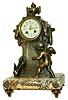 French cast metal and veined marble figural 8 day time and strike mantel clock, c1890