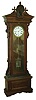 Wm. L. Gilbert Clock Co., Winsted Conn., "Regulator No. 16 Standing" floor clock, 8 days, time only, weight driven movement with pinwheel escapement, sweep seconds and three jar mercury pendulum in a walnut case with Egyptian head on pediment and white enamel dial, c1901