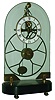 Asian reproduction of 8 day calendar skeleton clock with oversize great wheel, brass and glass, on ebonized wood base, (no dome), modern