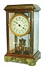 Germany, year running crystal regulator, gilt brass case with green onyx top and base, the stone with areas of white and red, beveled glasses, gilt, engine turned bezel, Arabic numeral white enamel dial with floral garland decoration, blued steel spade hands, rectangular brass movement with disc pendulum,  back plate marked "Patent Angemeldet/ Patents Applied", c1900