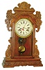 Clocks- 2 (Two) calendar clocks:  (1) Waterbury Clock Co., "Rochester", 8 day, time and strike calendar clock, c1908 and  (2) E. Ingraham & Co., 8 day, time and strike calendar clock (We could not find this model in the catalog).