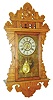 New Haven Clock Co., New Haven, Conn., "Eclipse " oak hanging gingerbread wall clock, 8 days, time and alarm, spring driven movement, American Wringer label, c1910