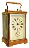 France, large grand sonnerie striking carriage clock with sweep seconds, polished brass Corniche case with beveled glasses, Roman numeral white enamel dial with Arabic alarm chapter, blued steel Breguet style hands, week going brass movement with sweep seconds and silvered lever platform, striking on two gongs, silence, petit sonnerie or grand sonnerie may be selected using the lever at the bottom of the case, c1900