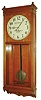 Seth Thomas Clock Co., Thomaston, Conn., "Master Clock M" wall clock, 8 days, time only, weight driven movement in an oak case with 18" painted metal dial signed "MASTER REGULATOR, PETTES & RANDALL CO. NEW YORK", c1922