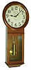 Ansonia Clock Co., New York, NY, "Standard Regulator" wall clock, 8 days, time only, weight driven movement in an oak case with papered metal dial with seconds bit, c1920