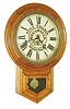 Waterbury Clock Co., Waterbury, Conn., short drop wall clock, 8 days, time only, spring driven movement in an oak case with advertising on painted metal dial "FORD TOULSON WATCHMAKER & JEWELER WOODSTOWN,", c1900