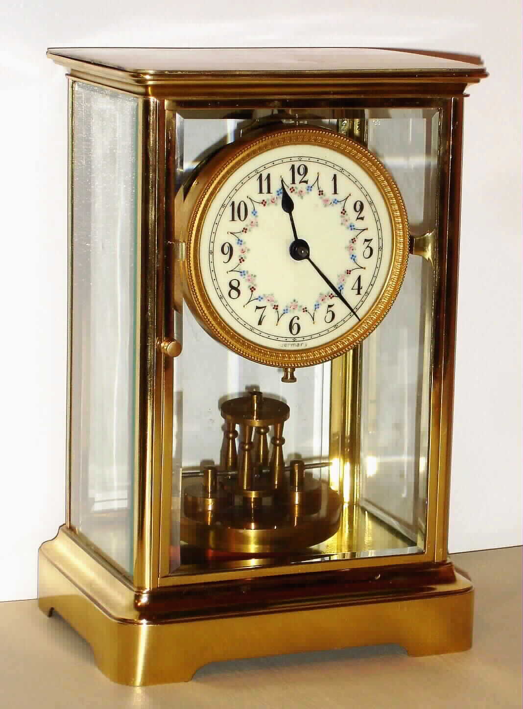German 400 day disk pendulum clock in polished brass and beveled glass crystal regulator case, c1910 — Antique Clocks Price Guide
