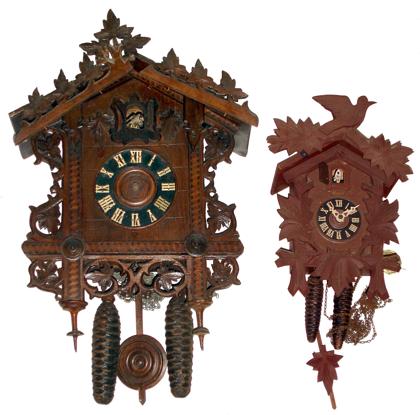Clocks- 2 (Two) German carved wood two weight 30 hour cuckoos: one early 20th century American Cuckoo Clock Co.; one modern Kuner with Regula works. Larger case ht 16" — Antique Clocks Price Guide