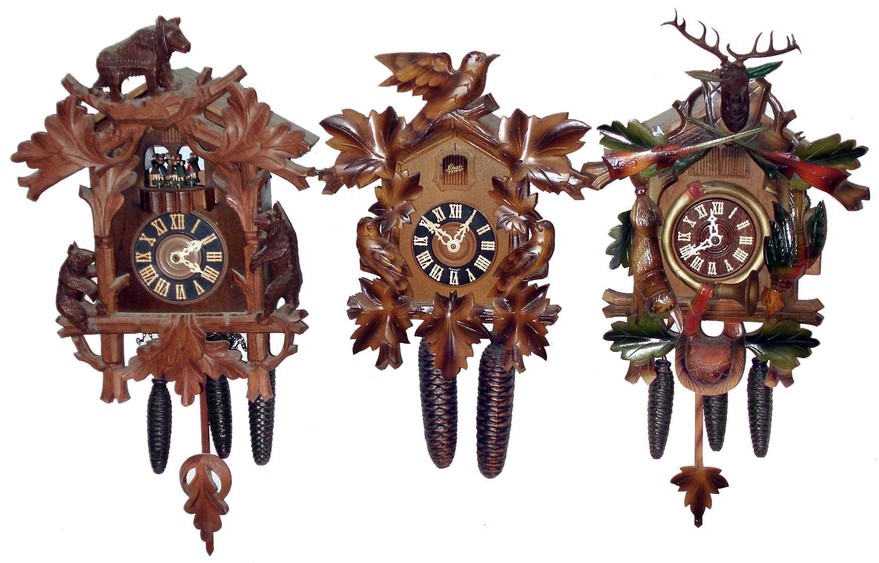 Clocks- 3 (Three) modern carved wood 30 hour cuckoos, two are 3-weight, late 20th century. — Antique Clocks Price Guide