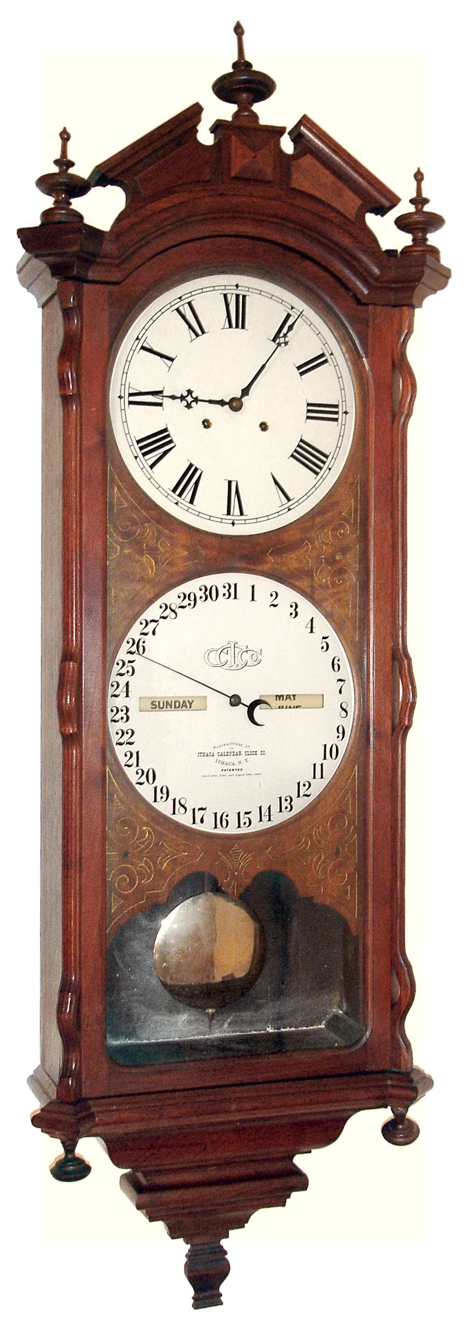 Ithaca Calendar Clock Co., Ithaca, New York "No. 2 Bank" double dial calendar regulator wall clock, 8 day, time only, two weight driven movement in a walnut case with engraved mask around paper over zinc dials, c1880 — Antique Clocks Price Guide