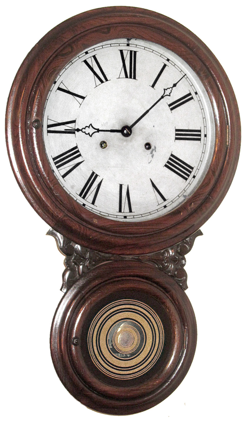 E.N. Welch Manufacturing Company, Forestville, Conn., "Ionic" later the "Alexis No. 1" wall clock, 30 day, time only, double spring driven movement in rosewood grained figure eight case with painted metal dial; nickel plated movement. Original Welch hands.  c1875 — Antique Clocks Price Guide