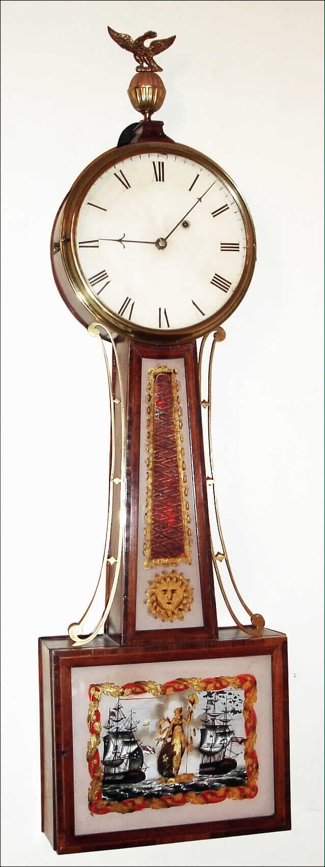 Willard school "Banjo" wall clock possibly by Elnathan Taber, Roxbury, Mass., 8 day, time only, weight driven movement with T-bridge suspension and fillister screws in inlaid cross banded mahogany case, reverse painted throat and lower tablets and painted iron dial, c1810 — Antique Clocks Price Guide