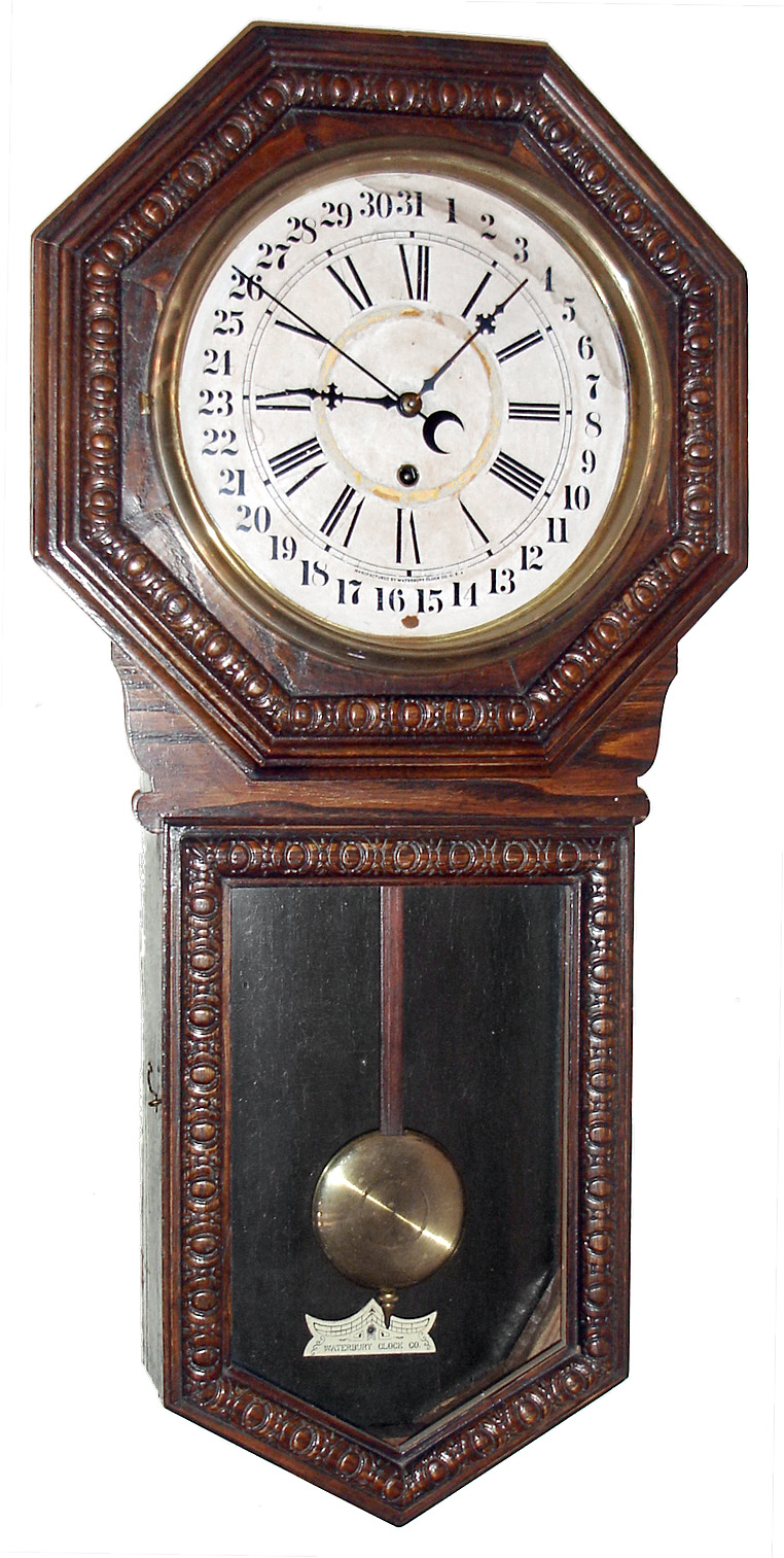 Waterbury Clock Co., Waterbury, Conn., "10 Inch Heron" wall clock, 8 day, time and calendar, spring driven movement in an embossed oak case with papered dial, c1905 — Antique Clocks Price Guide