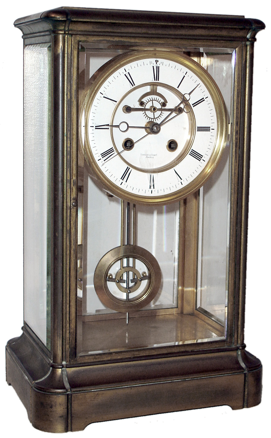 French for Tiffany and Comp, New York "Crystal Regulator", 8 day, time and bell strike, spring driven movement with center sweep seconds, compensated pendulum and white enamel dial in brass case with beveled glasses, c1900 — Antique Clocks Price Guide