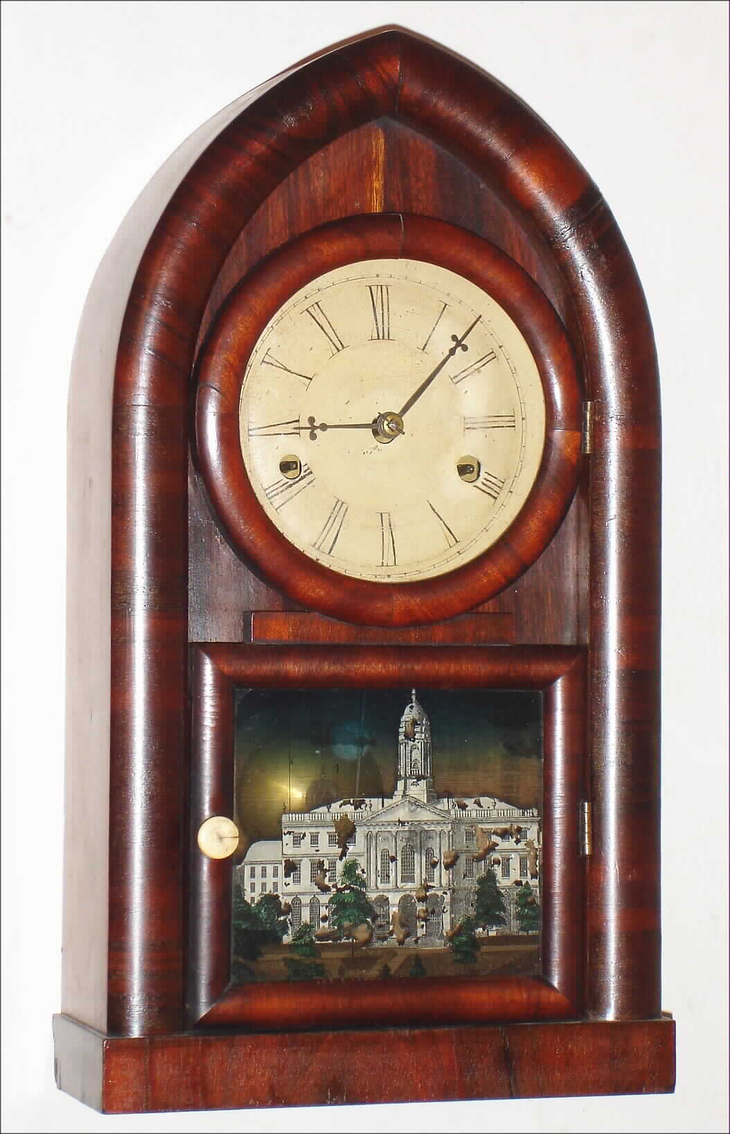 Forestville Manufacturing Co., J.C. Brown, Bristol, Conn., "Miniature Beehive" mantel clock, 30 hour, time and strike, spring driven movement in a mahogany veneer case with silk screen lower tablet and painted metal dial; tablet of Hartford, CT state house (still standing),  c1850 — Antique Clocks Price Guide