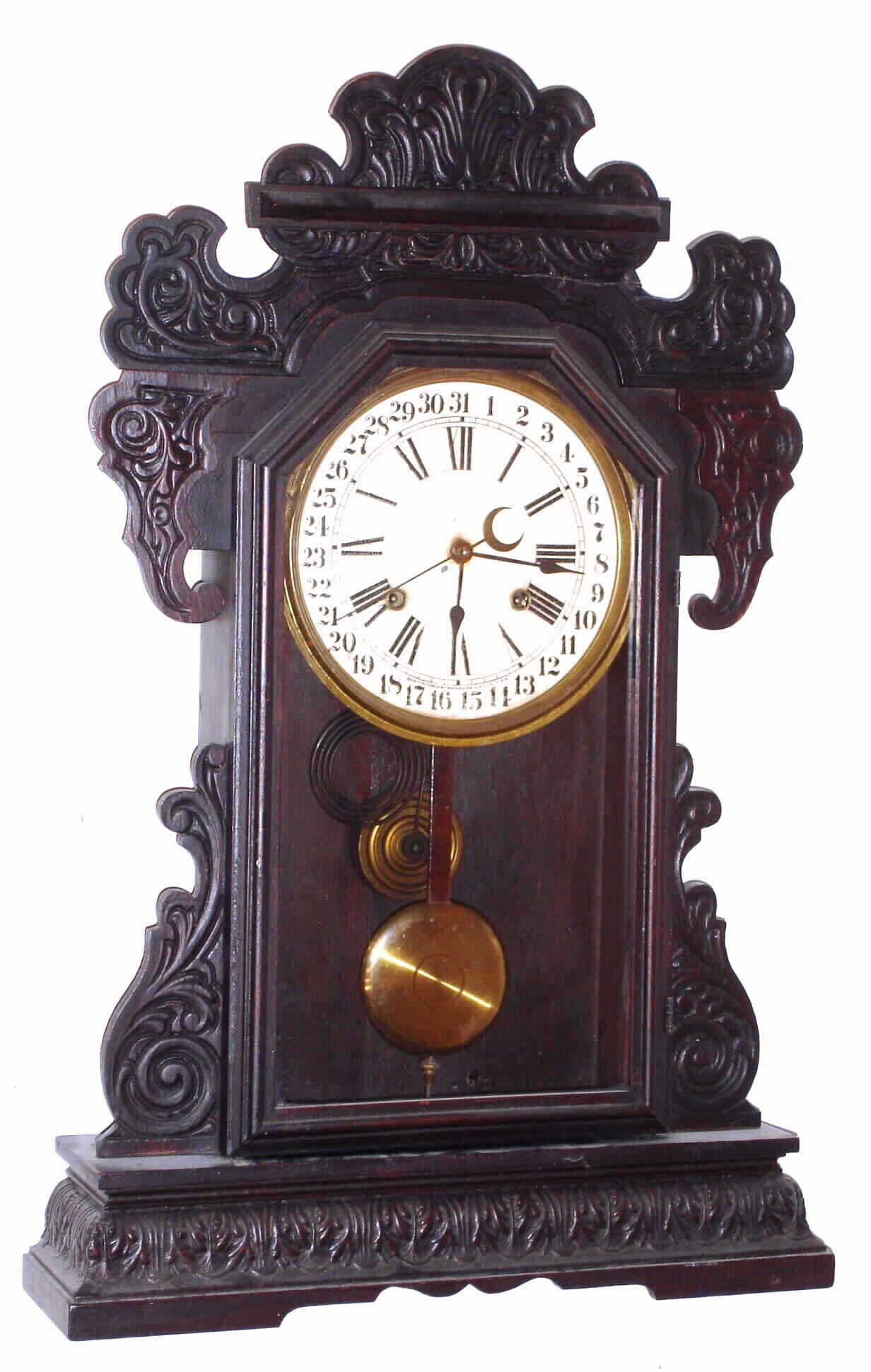 Waterbury Clock Co., Waterbury, Conn., "Rochester" walnut 8 day, time, strike and calendar oversize gingerbread clock, c1908 — Antique Clocks Price Guide