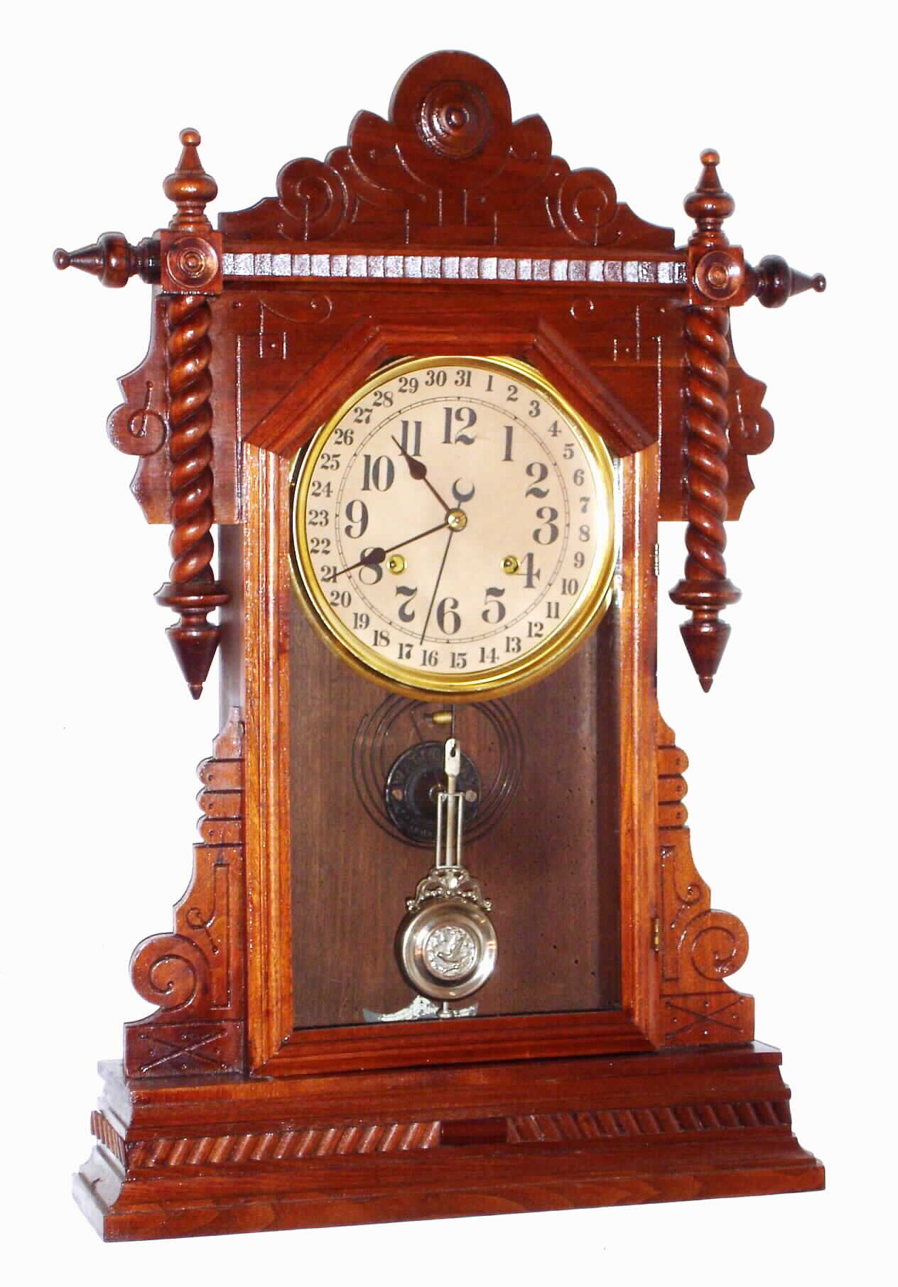 Waterbury Clock Co., Waterbury, Conn., "Buffalo" walnut 8 day, time, strike and calendar shelf clock, c1891 — Antique Clocks Price Guide