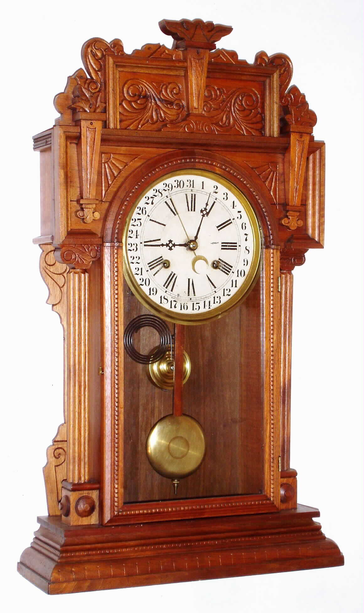 Waterbury Clock Co., Waterbury, Conn., "Niagara" walnut 8 day, time and strike calendar clock, c1911 — Antique Clocks Price Guide