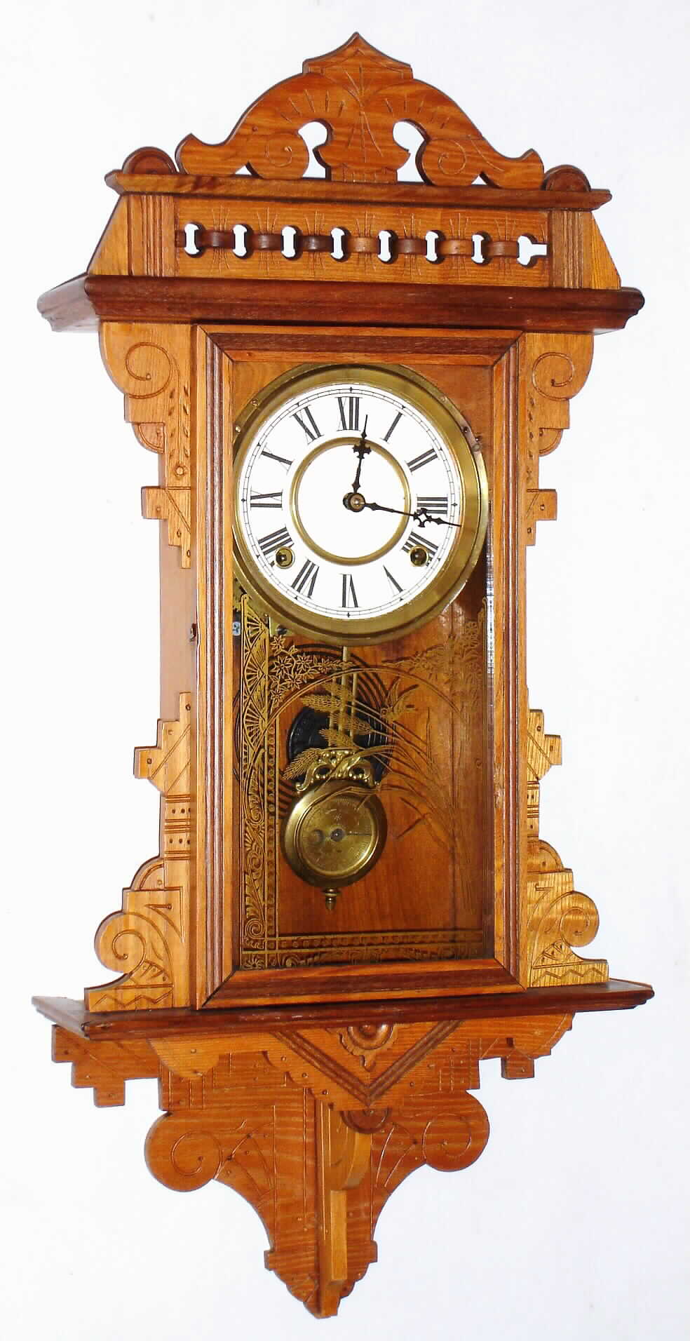 Waterbury Clock Co., Waterbury, Conn., "Hamilton" hanging ash 8 day, time and strike gingerbread clock, c1891 — Antique Clocks Price Guide