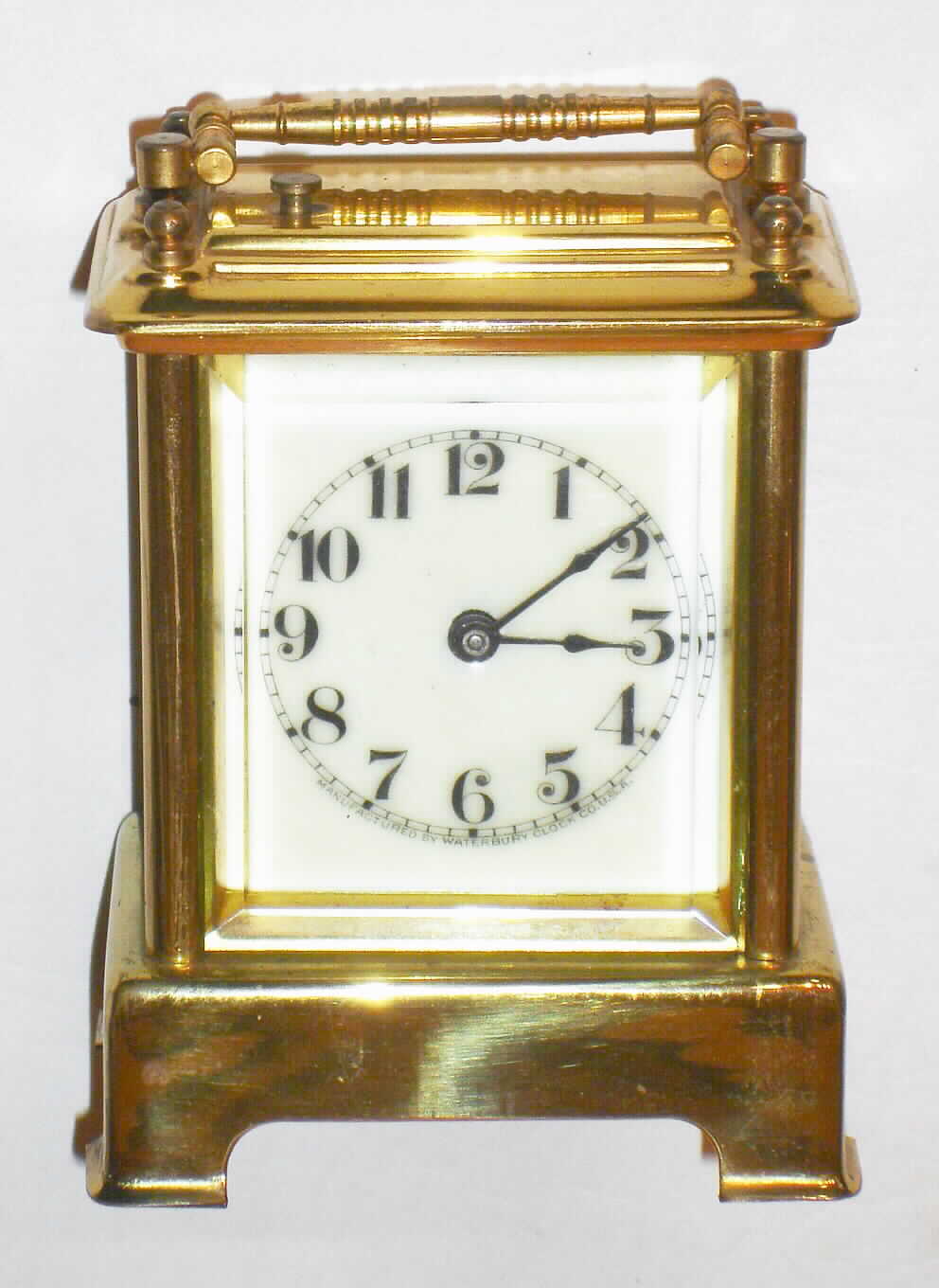 Waterbury Clock Co., Waterbury, Conn., "Conductor" brass and glass 30 hour time, strike and repeat carriage clock with leather covered travel case, c1893 — Antique Clocks Price Guide