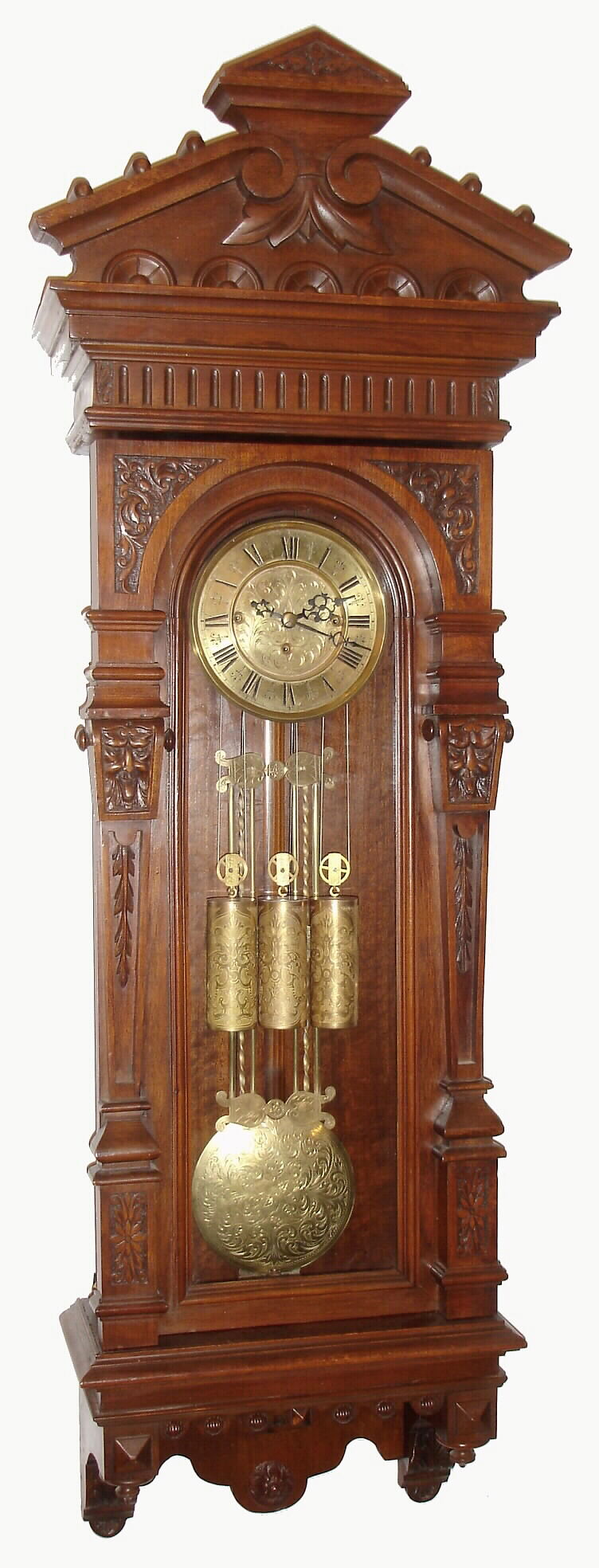German, Gustav Becker, 3-weight, Grand Sonnerie "Vienna Regulator", with a fancy multi rod "faux-grid" pendulum, the dial center and pendulum with matched scroll engraving; weights with a different pattern, in a case of carved walnut and veneers, c1885 — Antique Clocks Price Guide