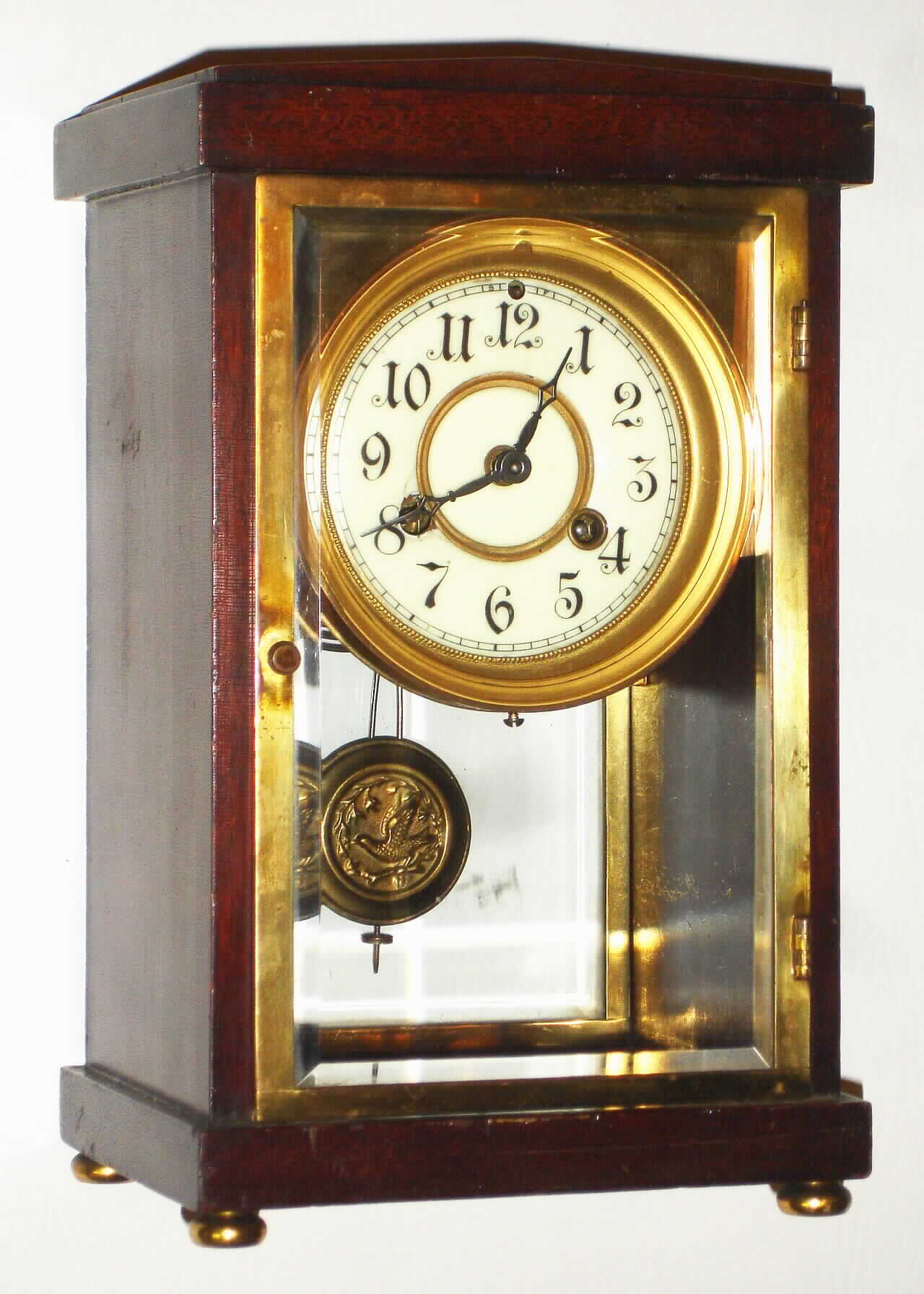 Waterbury Clock Co., Waterbury, Conn., "Richelieu" mahogany 8 day, time and strike crystal regulator, c1915 — Antique Clocks Price Guide