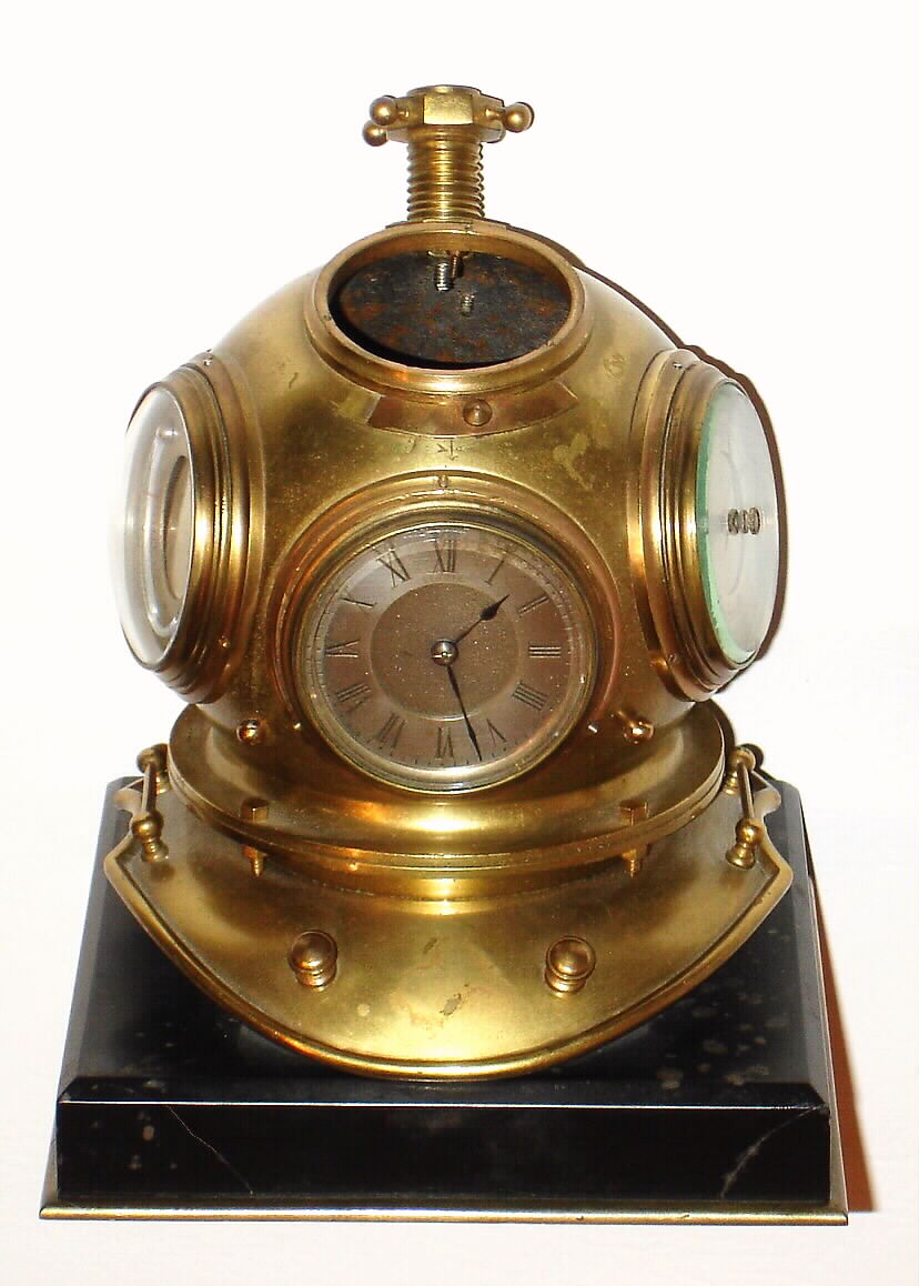 French, "Diver's Helmet", time piece with Barometer, Thermometer, and compass (missing). This clock is from the Industrial series, c1885 — Antique Clocks Price Guide