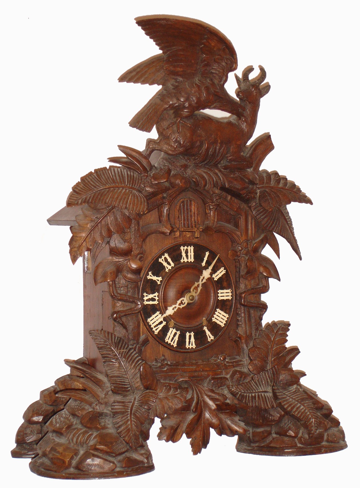 German, Black Forest shelf cuckoo, with wooden plated , 8 day, movement, double fusee, the case profusely decorated with ferns and surmounted by a large eagle bravely attacking a mountain goat, c1880 — Antique Clocks Price Guide