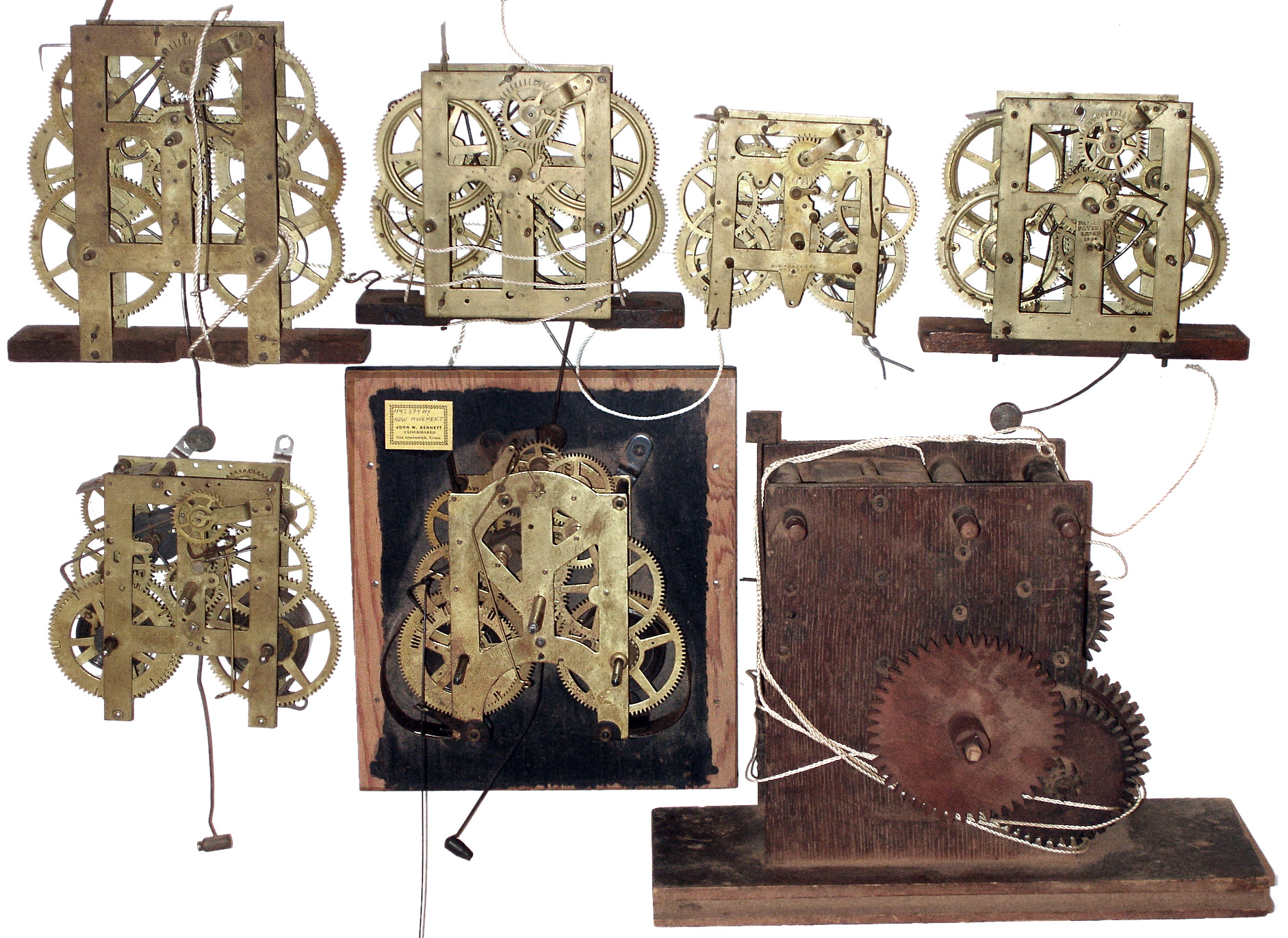 Clock movements- 7 (Seven) including one wooden works long case and six time and strike brass, 19th century — Antique Clocks Price Guide