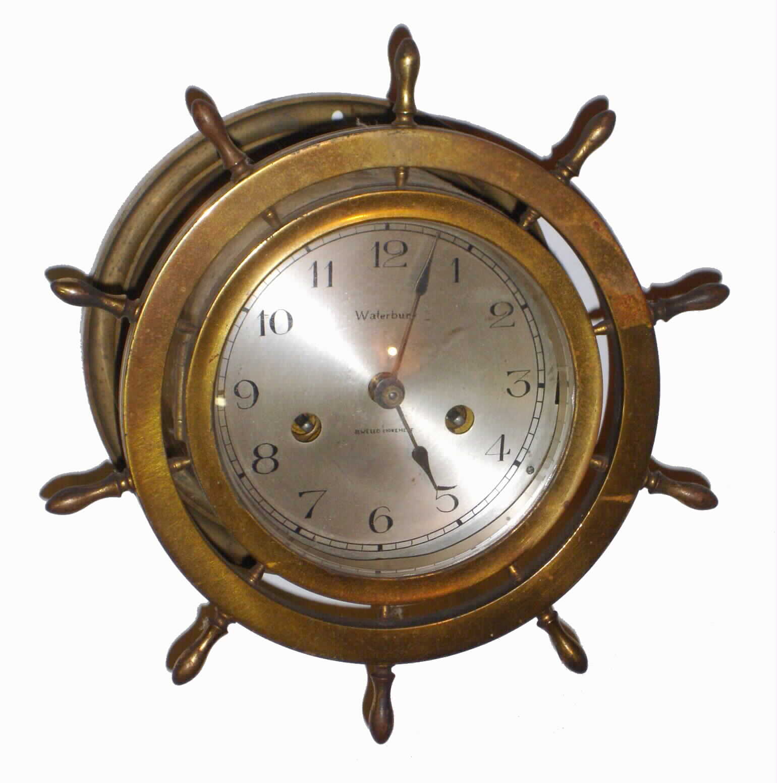 Waterbury Clock Co., Waterbury, Conn., "Ship's Bell No. 10" brass 8 day striking marine clock with hinged yacht wheel bezel, c1915 — Antique Clocks Price Guide