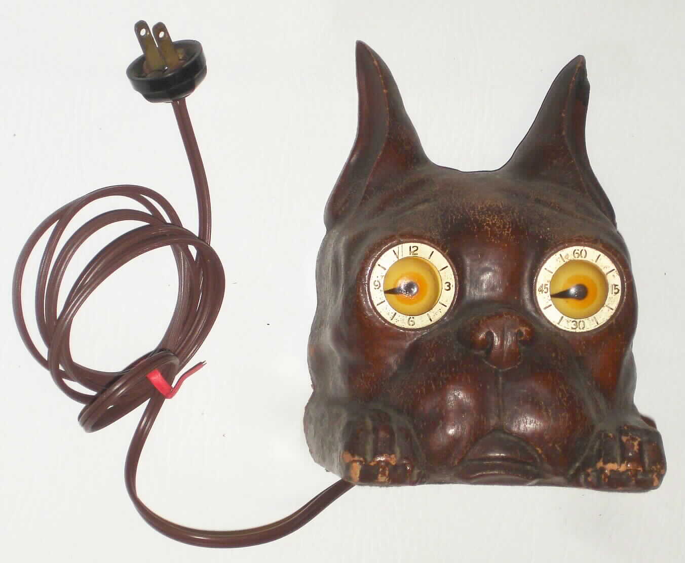 Mastercrafters, Chicago, Ill, "The Duke", plug-in electric molded composition rotating lighted eye clock, c1955 — Antique Clocks Price Guide
